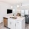 a kitchen with a couch and a sink