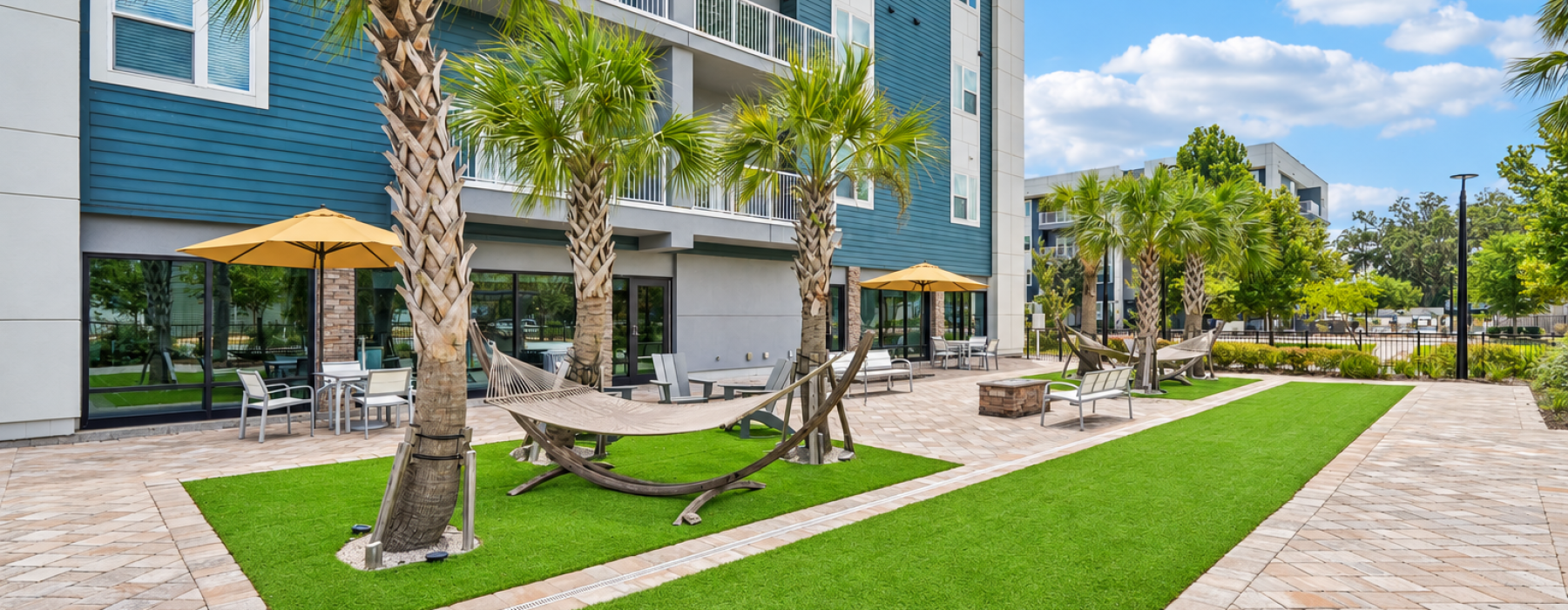 Exterior with hammocks and palm trees