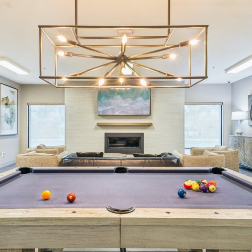 Pool table with chandelier above