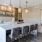 a kitchen with a bar and chairs