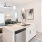 a kitchen with a couch and a sink