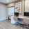a room with a desk and computer