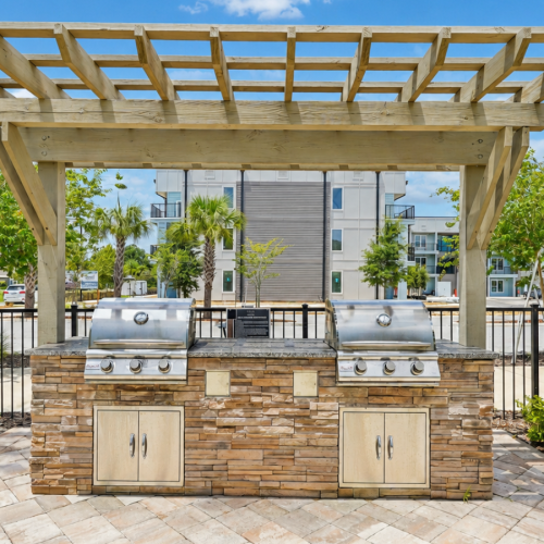 Pergola with 2 grills outdoors