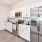 a kitchen with white cabinets
