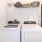 a washing machine and dryer in a room