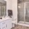 a bathroom with a shower and sink