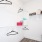 a room with a shelf and a basket with objects on it