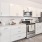 a kitchen with white cabinets