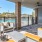 a deck with a patio and a view of the ocean