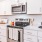 a kitchen with white cabinets
